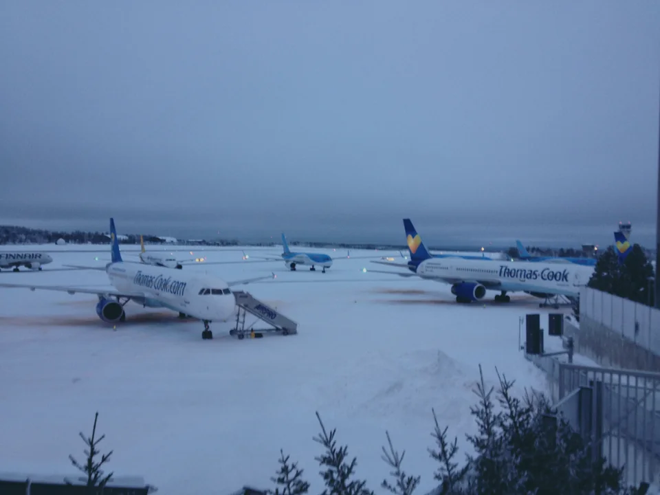 Charter aircraft parked on the snowy apron at Rovaniemi Airport in December 2013
